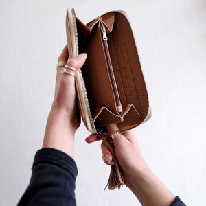 WOMAN'S ZIP AROUND WALLET-NUDE COLOR